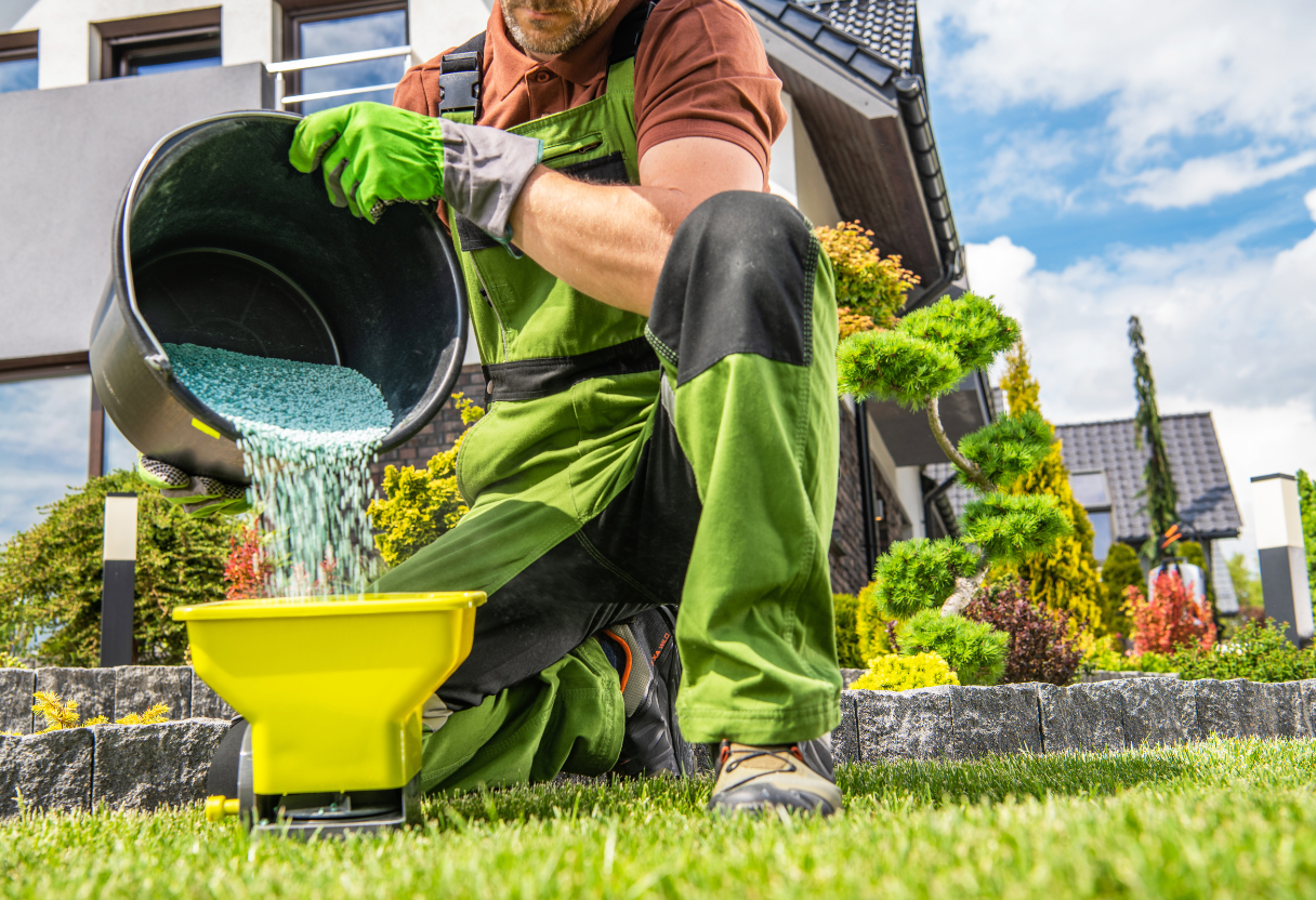 a man pouring fertilizer into a bucket